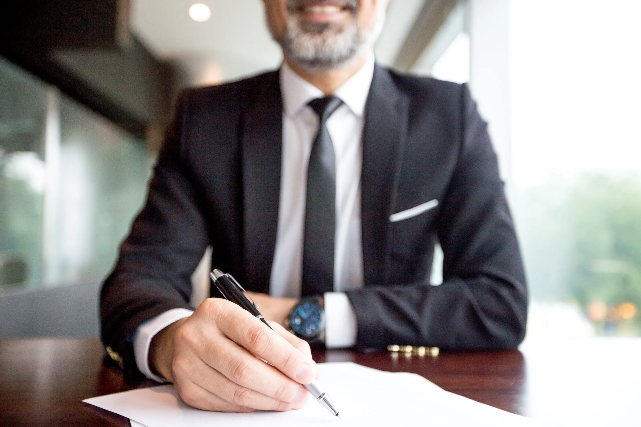 Close-up of an attorney reviewing case paperwork at a desk